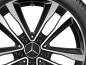 Preview: Detailaufnahme einer Mercedes-Benz Leichtmetallfelge, die das filigrane Design der schwarz-silbernen Speichen und den markanten Mercedes-Stern im Zentrum zeigt. Preview: Detailaufnahme einer Mercedes-Benz Leichtmetallfelge, die das filigrane Design der schwarz-silbernen Speichen und den markanten Mercedes-Stern im Zentrum zeigt.