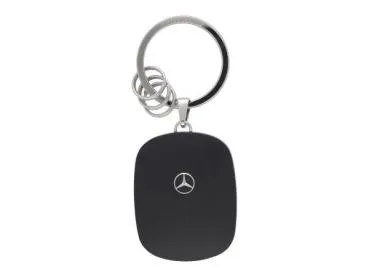 Mercedes-Benz Schlüsselanhänger in Wallbox-Form mit schwarzer Front, edlem Mercedes-Stern-Logo und hochglanzpoliertem Edelstahl-Ring, inklusive drei kleinen Minispaltringen zur einfachen Schlüsselorganisation.